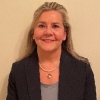 Vivian Riesenman with dark jacket and necklace