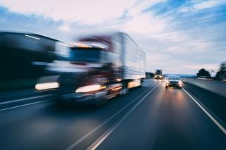 Big rig 18-wheeler semi-truck motion blur transportation concept